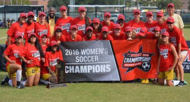 ASU Lady Hornets with the SWAC Conference women's soccer championship banner. (ASU Lady Hornets photo)
