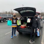 Zack Rogers and Devin MacPhee with food donations