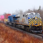 CN employee walking up to train